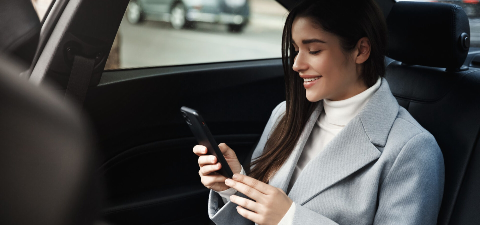 smiling-woman-traveling-by-car