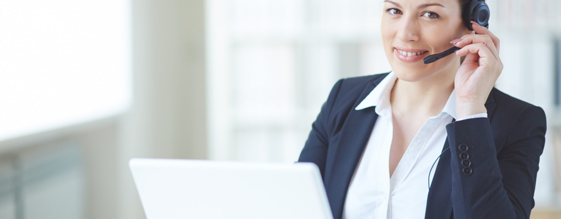 young-executive-working-with-headset-laptop